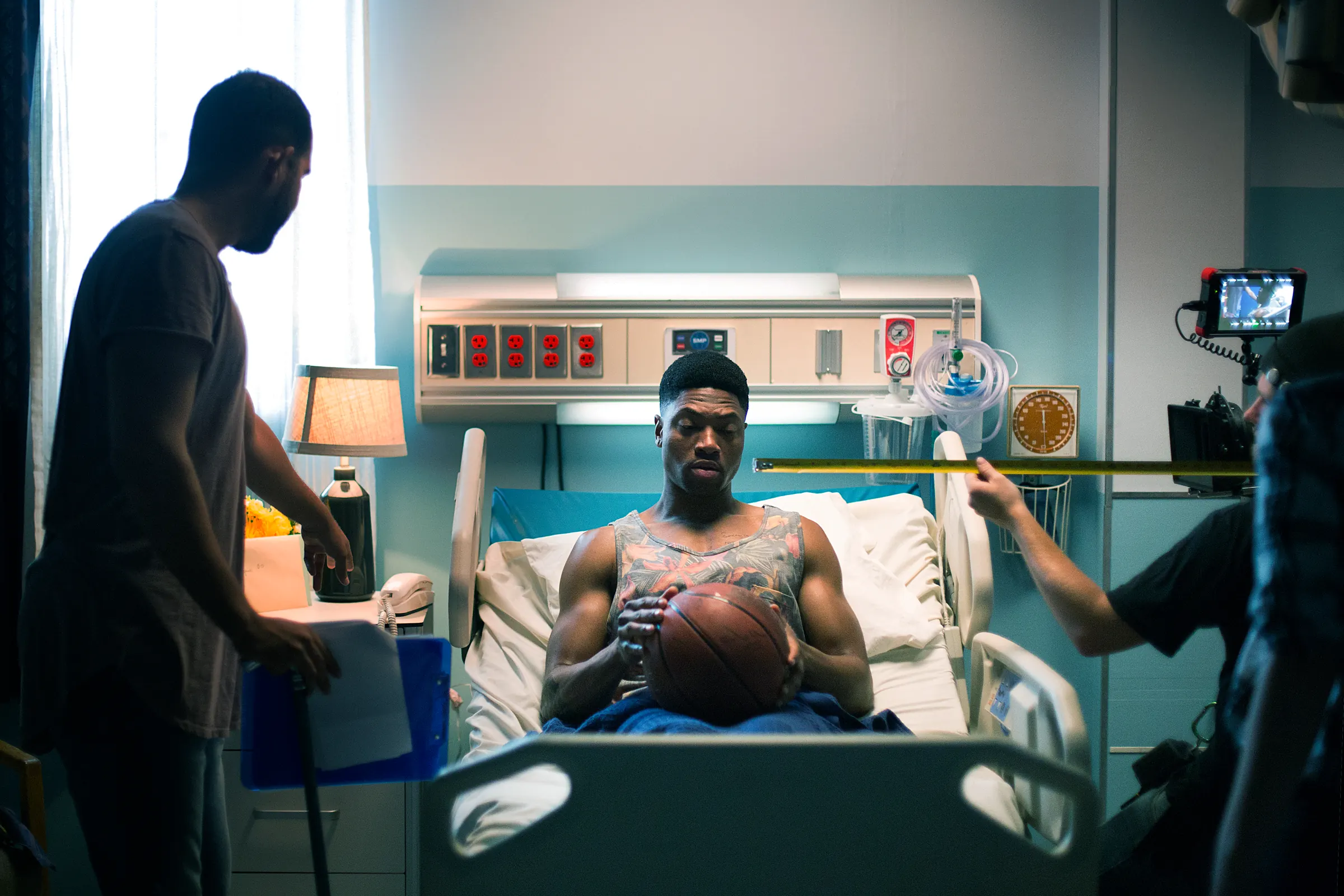 The crew films a hospital-bed scene on the set of ASIA A.